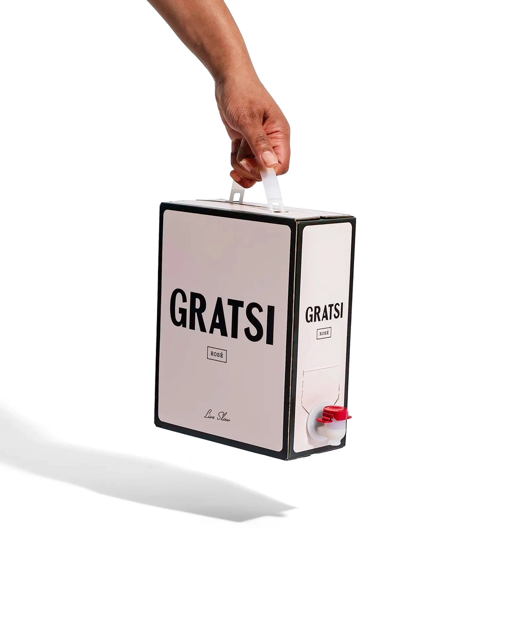Gratsi Rosé Wine, poured beside fish and pizza