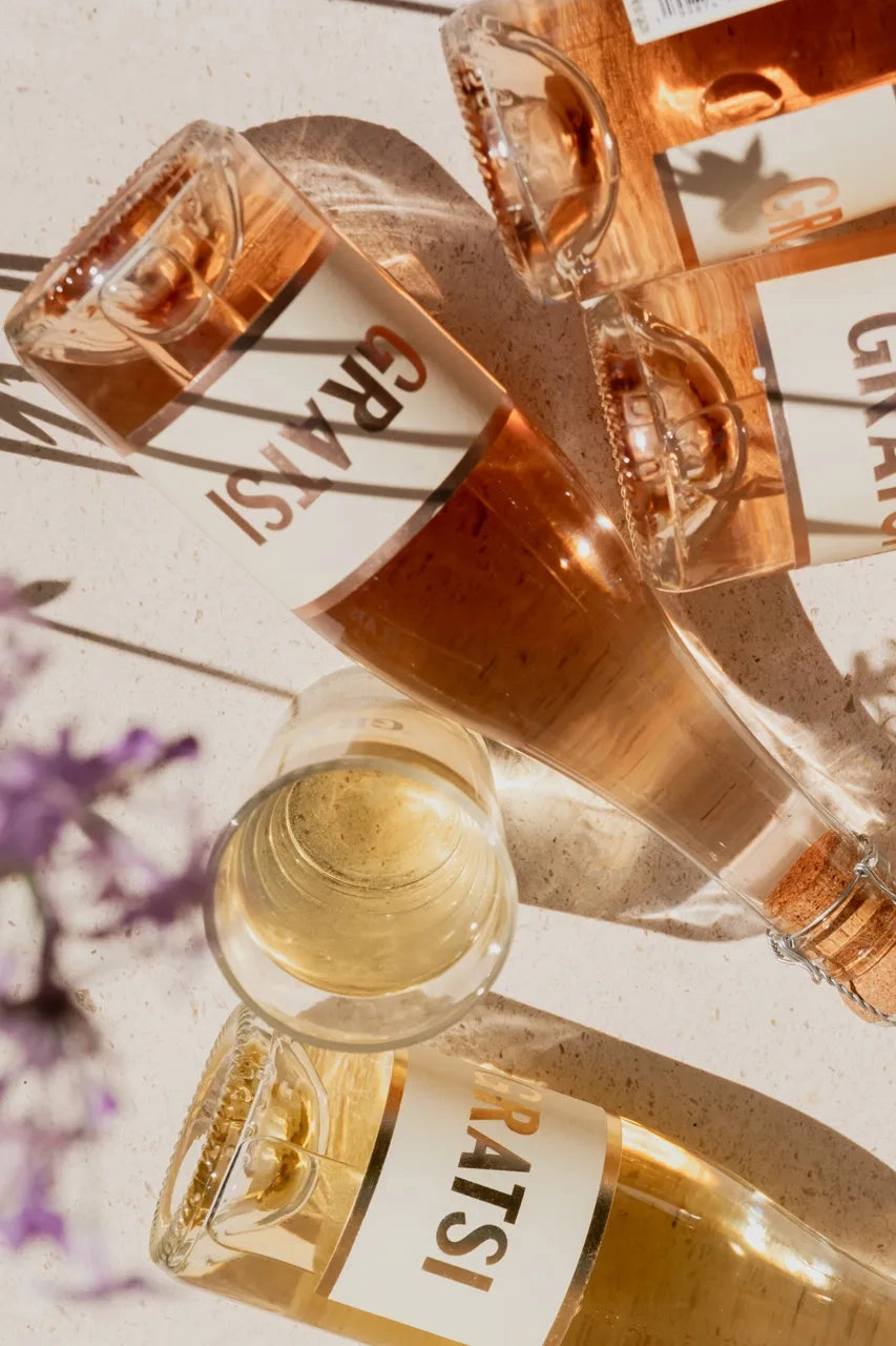 Sparkling rosé bottles from the Gratsi Sparkling Variety Pack, set for a meal.